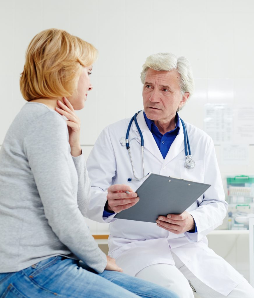 Doctor discussing cancer symptoms with patient
