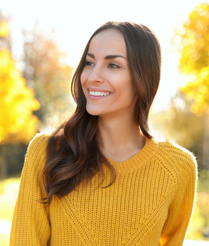 Woman in a yellow sweater