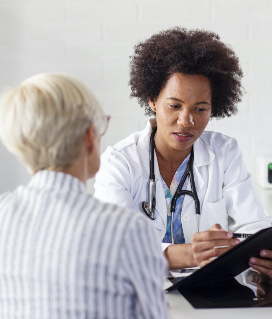 Doctor discussing pap smears with a patient